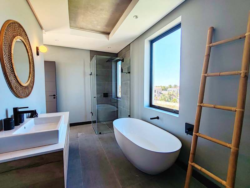 Freestanding bathtub with sea light at Drift Sunset Beach House